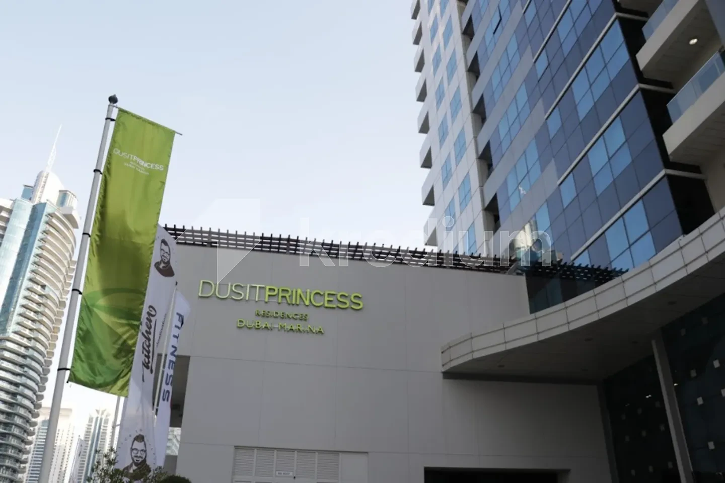 Entrance to a sleek high-rise building with a Dusit princess sign