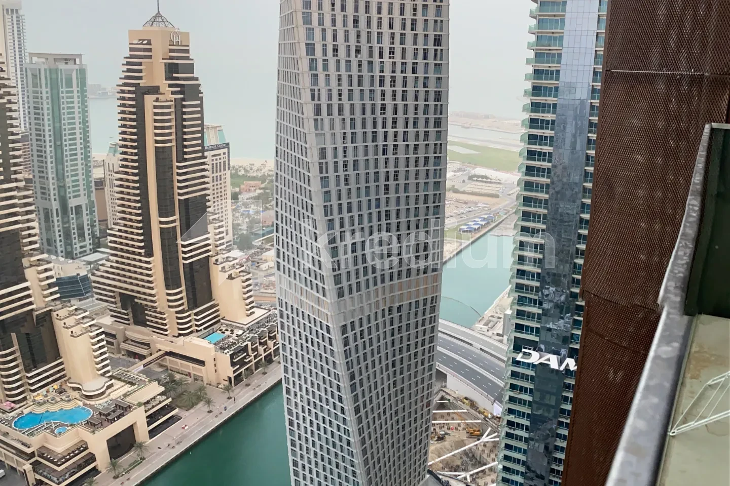 Luxurious modern skyscraper overlooking a canal