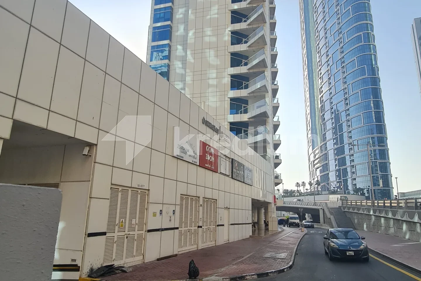 A large tower next to a busy road