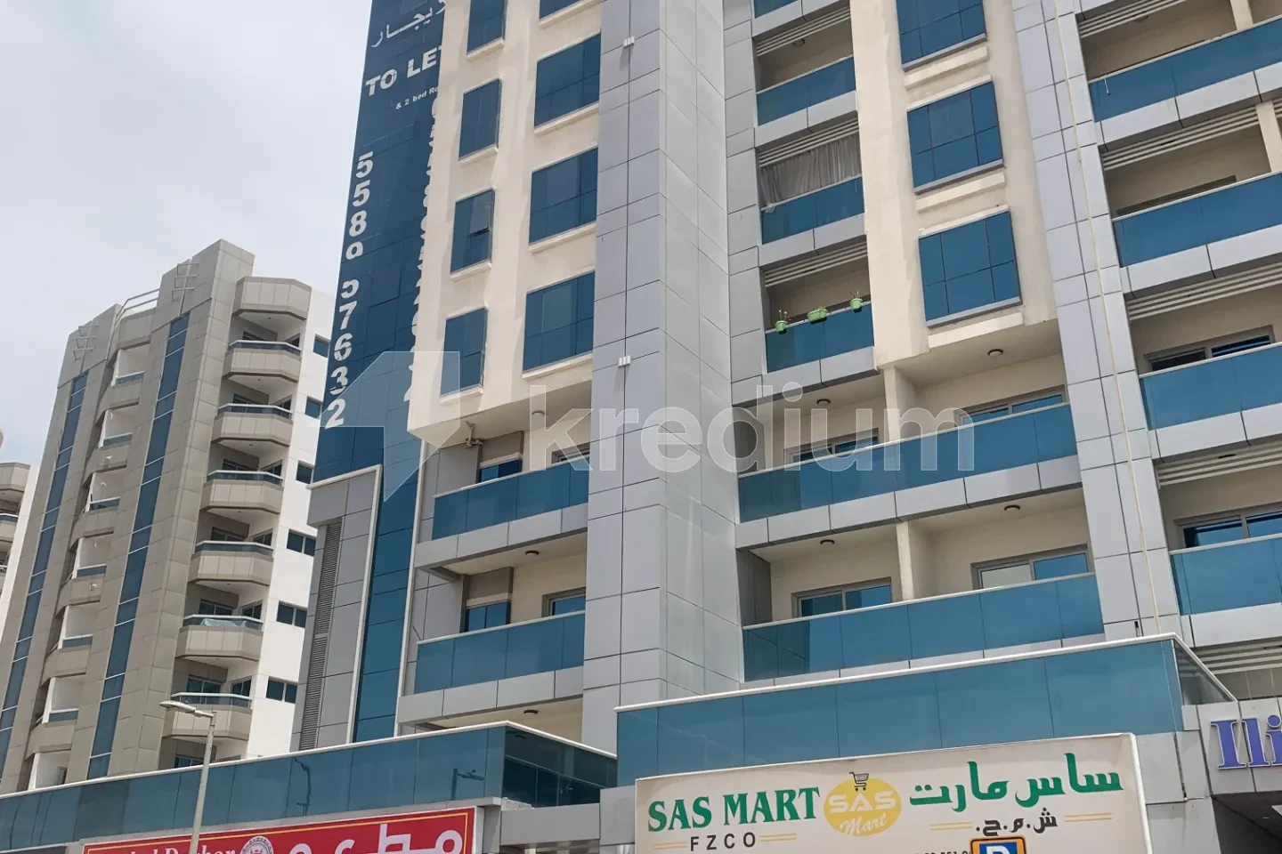 Part of a high-rise building with glass balconies