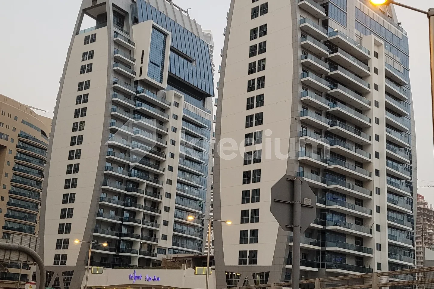 Two modern multi-story buildings connected by the same entrance