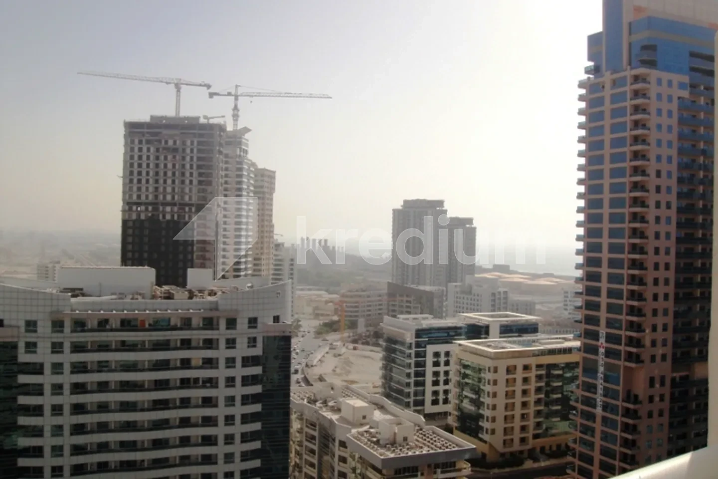 A group of mid-rise and high-rise modern buildings