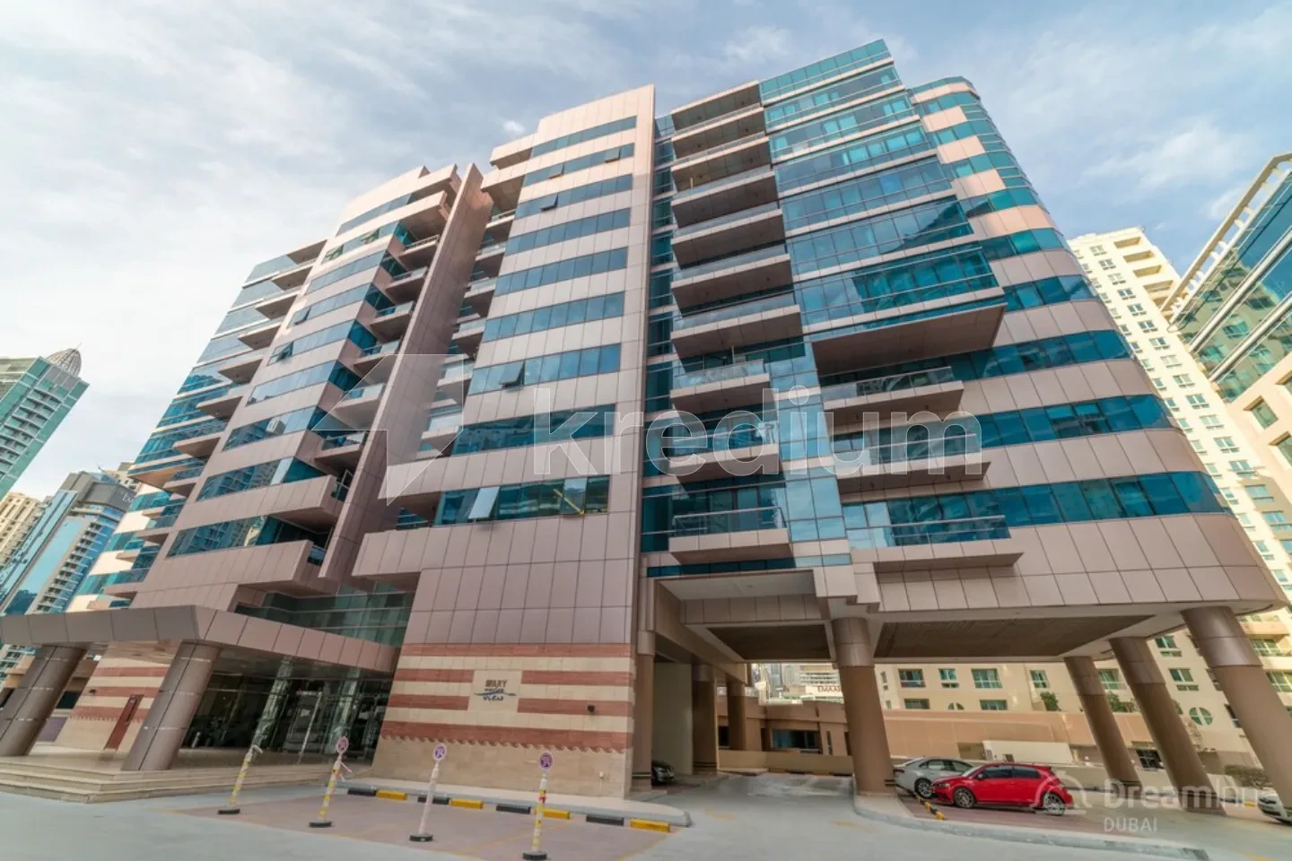 Contemporary residential building with a parking lot.