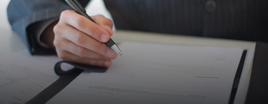 A man signing a contract