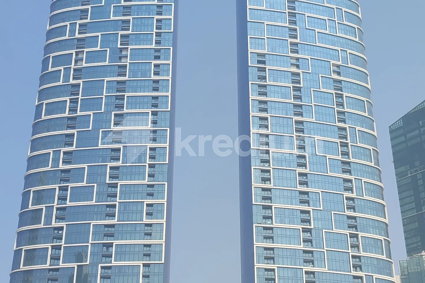 Two elegant glass skyscrapers