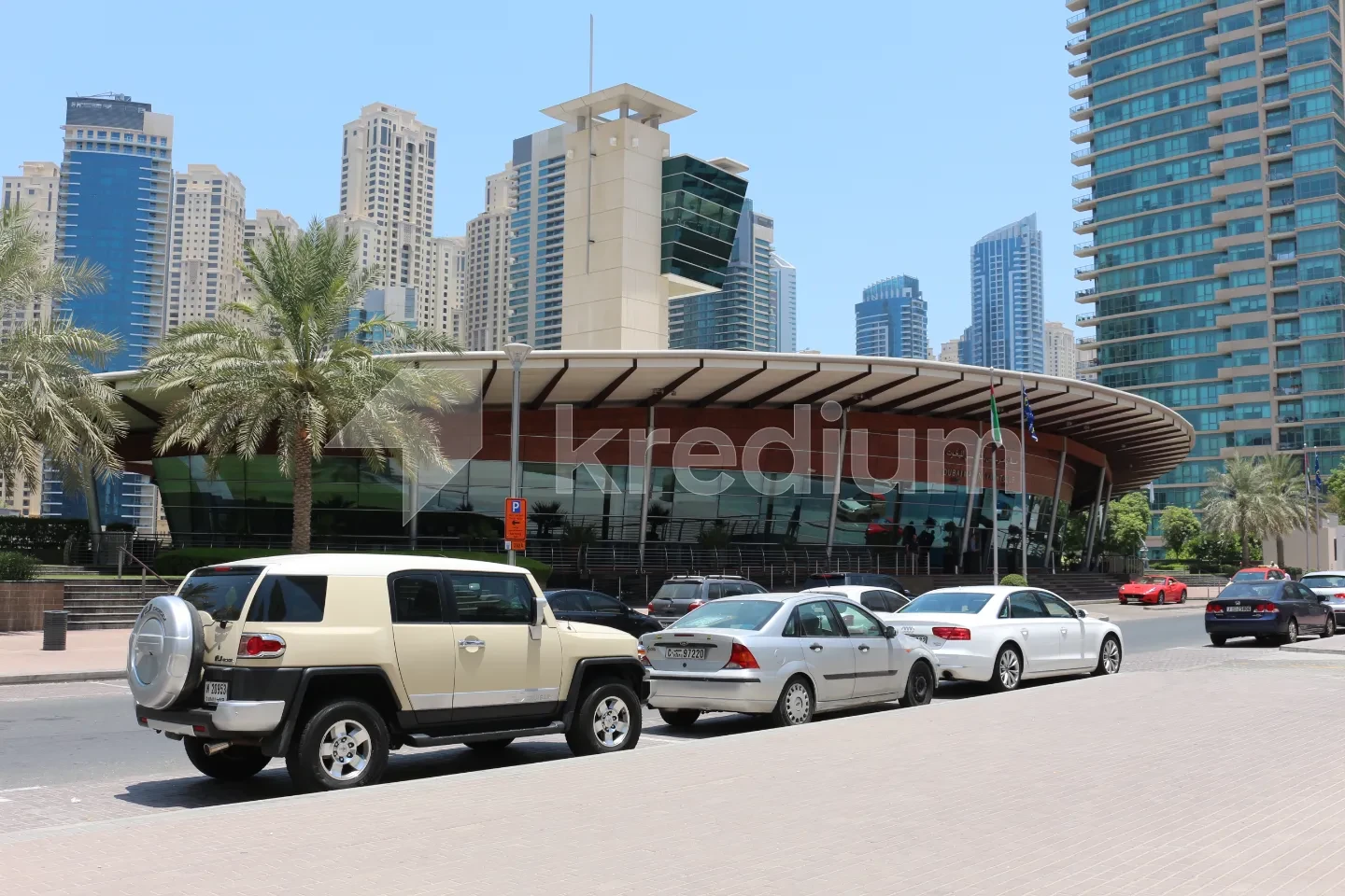 A sleek modern building next to a busy street