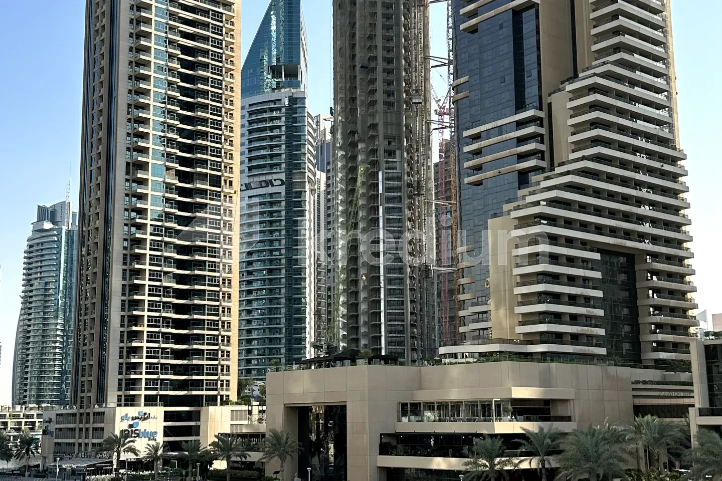 A group of modern tall glass and steel buildings