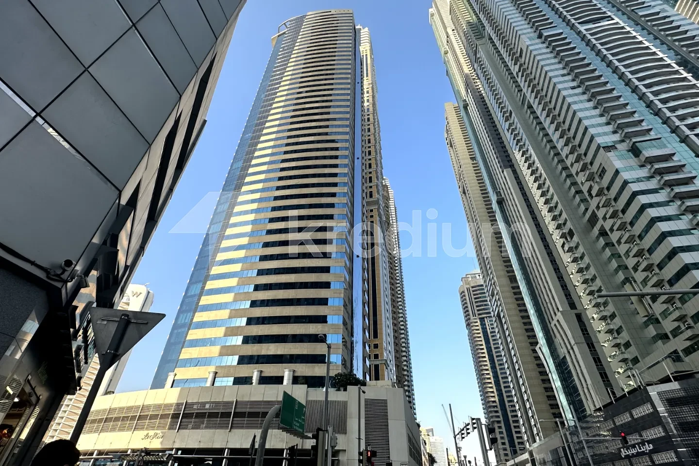 Modern glass skyscraper in an urban neighborhood