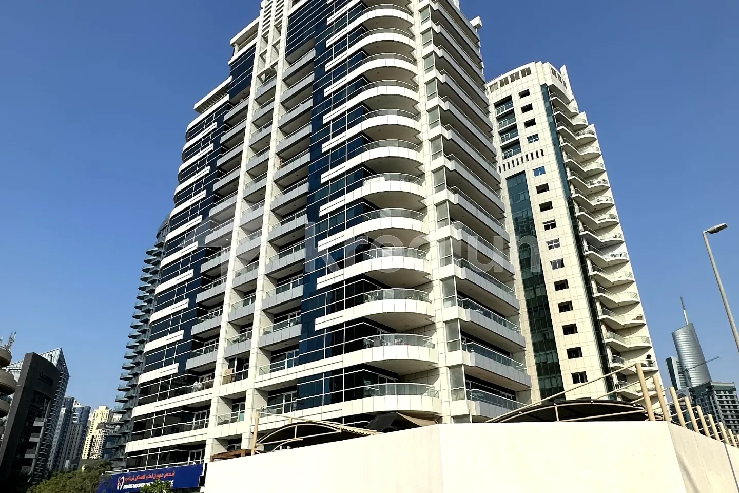 A glass high-rise residential building