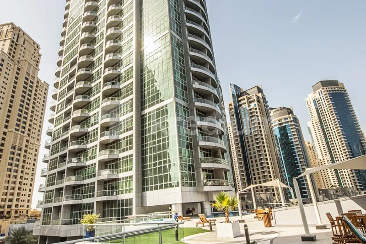 A stylish tower in a busy neighborhood