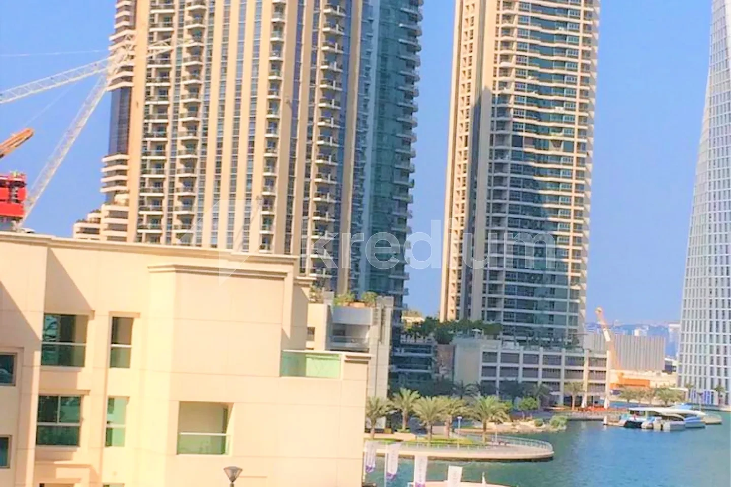Two modern towers overlooking a body of water